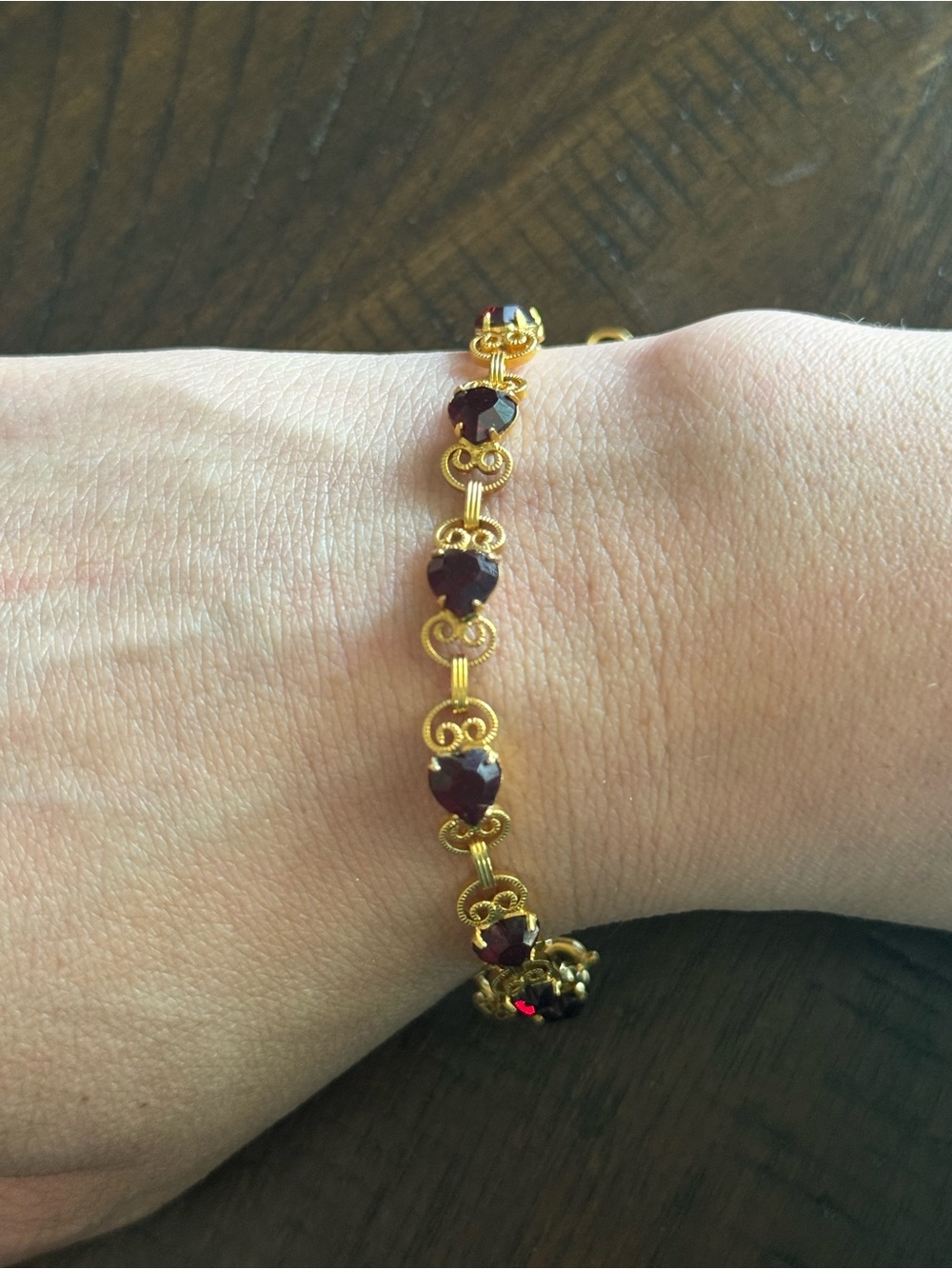 Source Unknown Gold Tone Bracelet with Deep Red Heart Stones